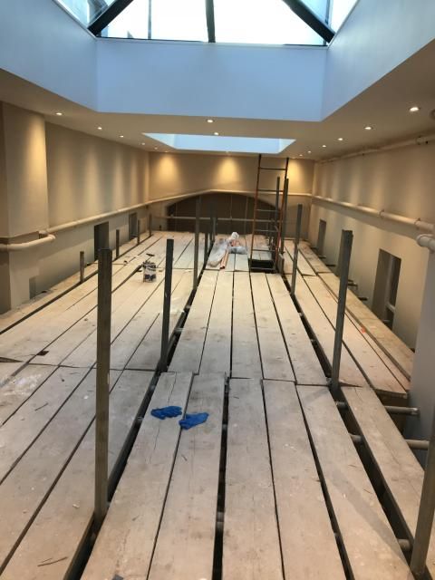 Atrium with the floor stripped back to joists
