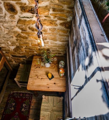 Dining table in the barn with a pendant above